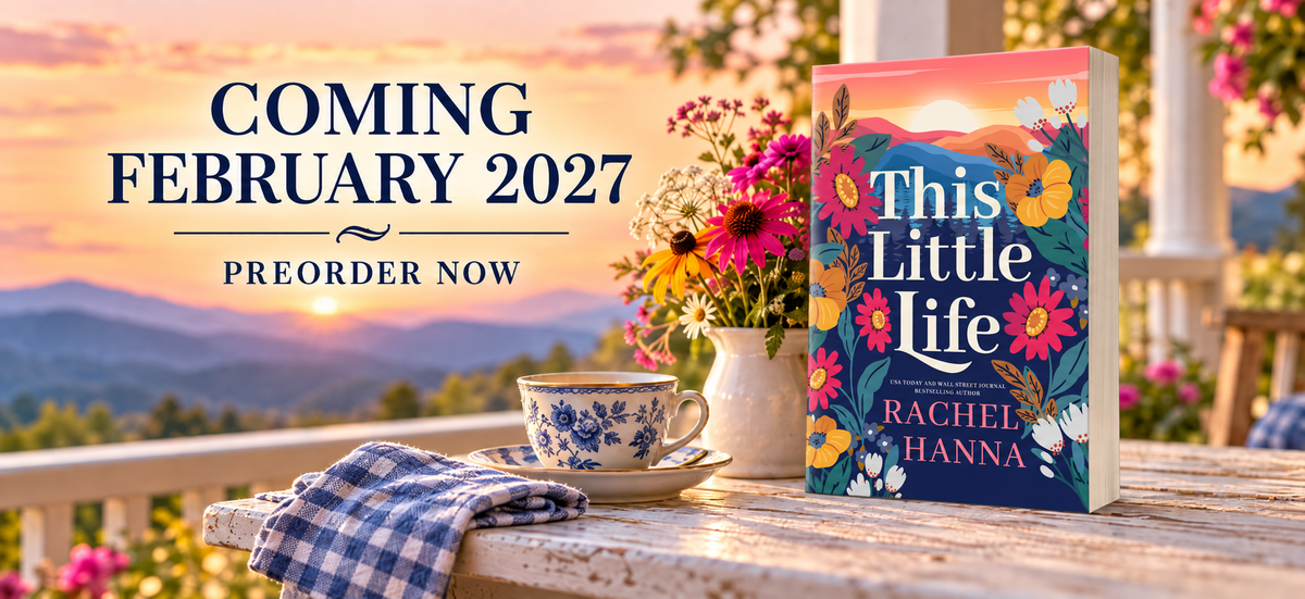 This Little Life by Rachel Hanna, coming February 2027. Preorder now. The paperback on a porch table with wildflowers and a teacup at sunset over the mountains