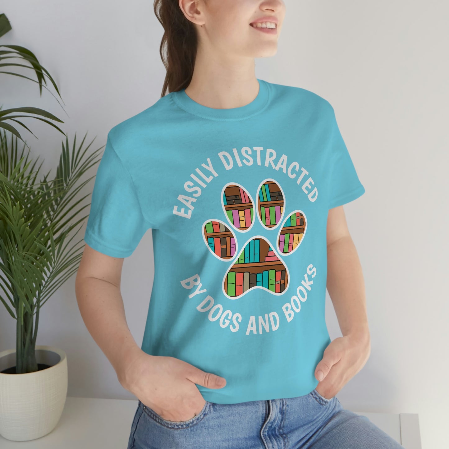 EASILY DISTRACTED BY DOGS AND BOOKS - Unisex Jersey Short Sleeve Tee